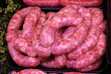 Raw Italian sausage ready to be cooked. Meat for sale in the butcher's shop