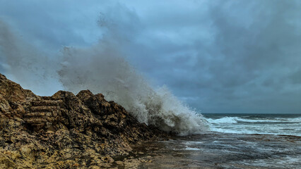 waves crashing on rocks