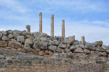 Ruins of the Baal-Saturn temple in the ancient Roman city of Dougga, Tunisia, Africa. Blue sky with...
