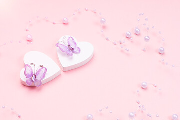 Two white hearts with butterflies on a pink background.Valentine s day concept.Greeting card. Love concept