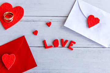Valentine's Day concept, Hearts and love letter on wooden background