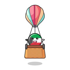 kuwait flag mascot riding a hot air balloon