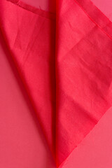 red fabric on red paper