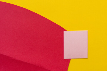 paper background in red, pink, and yellow