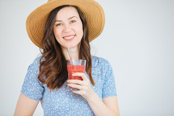 Woman holding a mug with red fruit smoothie. healthy lifestyle. Lose weight with a smoothie 