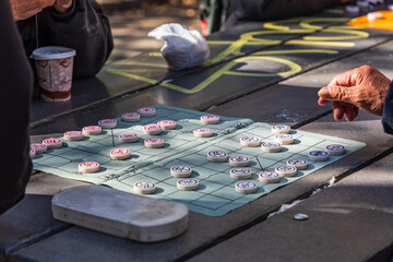 People playing Chinese Chess in Columbus Park.