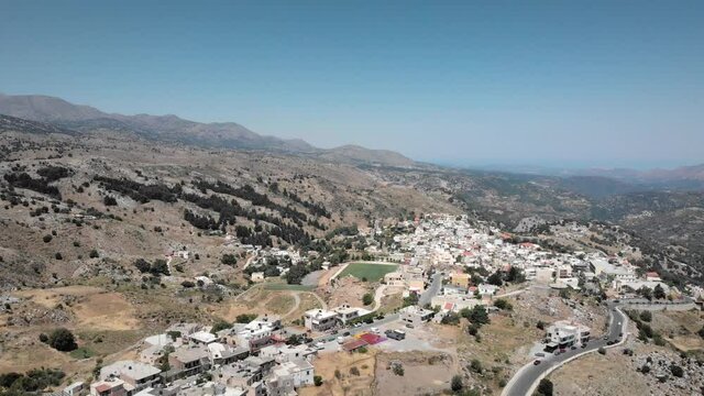 Scenic view of rethymno town with mountains on sunny summer day