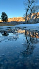 Reflection of a sunset over a pond