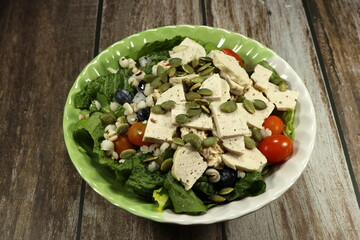 Fresh and organic healthy salad serving in the bowl. Famous diet menu in Asian restaurant. 