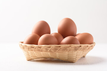 Fresh organic chicken eggs on white background.