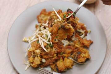Oysters fried in egg batter, Pan-fried crispy mussel with bean sprout, Crispy Mussel and Beansprout Pancake