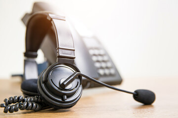 Headset and telephone for communication helpdesk IT support or call center and customer service.