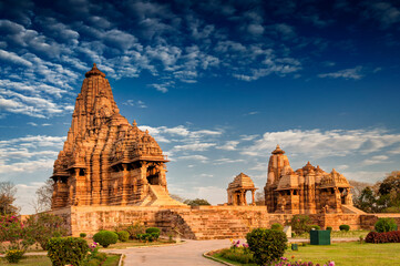 Beautiful image of Kandariya Mahadeva temple, Khajuraho, Madhyapradesh, India with blue sky and...