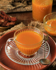 Kunyit Asam is Indonesian Traditional Herbal Drink for Women. Made from Turmeric and Tamarind and other Herbs