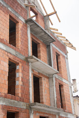 brick house under construction in Bistrita, concrete belts for brick construction  Romania, 2022, January 