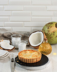 Homemade Round Coconut Pie. Made from Butter and Flour, and Stuffed with Young Coconut Flesh in the Center. Serve on Round Stone Plate. Copy Space