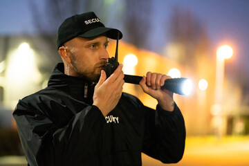 Security Guard Officer Using Walkie-Talkie Radio - obrazy, fototapety, plakaty