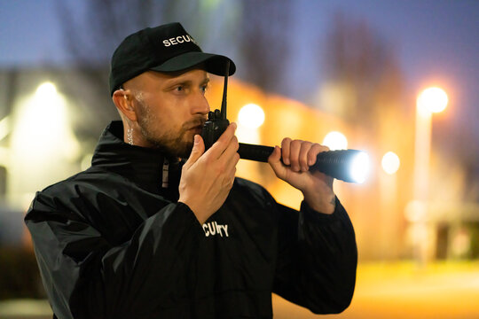 Security Guard Officer Using Walkie-Talkie Radio