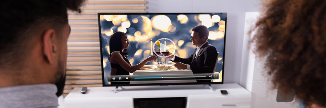 Couple Connecting Television Through WiFi On Digital Tablet - Powered by Adobe