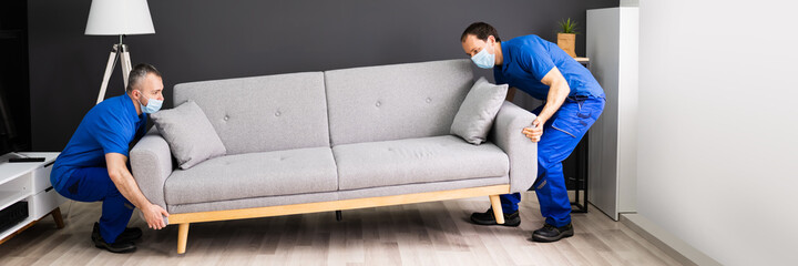 Professional Movers Moving Couch Furniture
