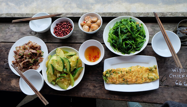 Simple local meal prepared by restaurant owner in Sapa Valley, Vietnam