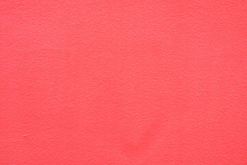 Red concrete wall with rough texture. Wall texture. Red background. Outer wall with mottled surface. Newly renovated walls. Home wall background