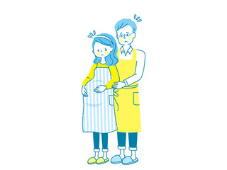 お腹の中の赤ちゃんを心配する妊婦と寄り添う夫
