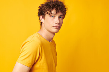 portrait of a young curly man Youth style glasses studio casual wear isolated background unaltered