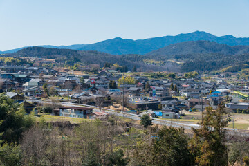 Fototapeta na wymiar Gifu, Japan - Mar 25 2020 - Beautiful scenic view from Between Magome-juku and Ochiai-juku on Nakasendo in Nakatsugawa, Gifu, Japan. Nakasendo is famous ancient road.