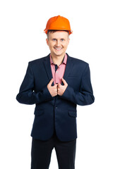 A man in a business suit and helmet smiles and looks at the camera. businessman, engineer, supervisor, builder. isolated