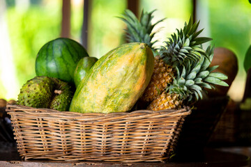 papaya, pineapple and other fruits on the basket