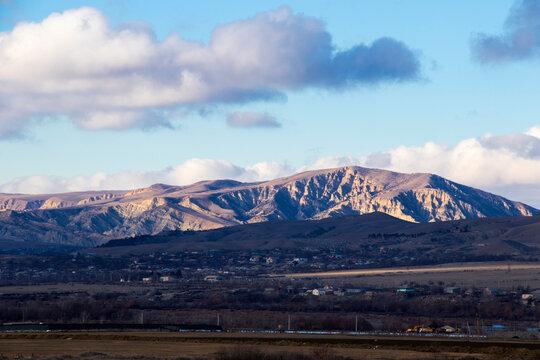 Mountain and town landscape during sunset