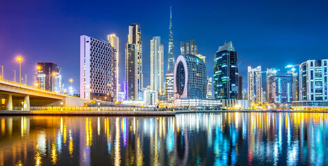 Panorama of night Dubai city skyline, UAE - obrazy, fototapety, plakaty