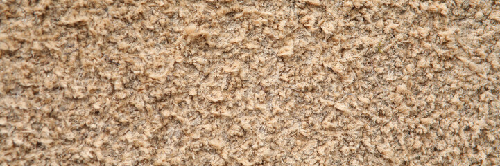 Beige background texture of hard carpet close up