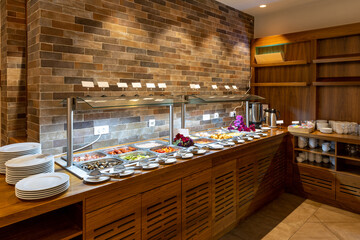 Breakfast served on a buffet table in a hotel restaurant