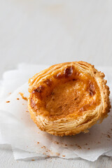 Close up of Pasteis de Belem ,Portuguese egg custard tart pastry dusted with cinnamon.