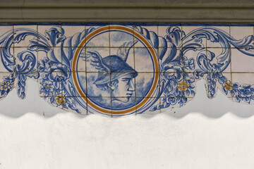 Colorful azulejos tiles on the exterior wall of a old shop in Aveiro, Portugal