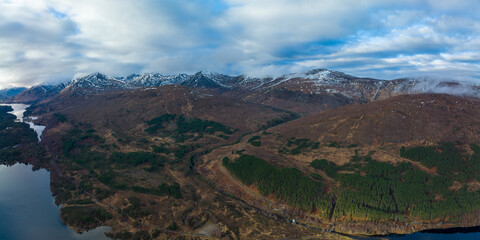 Aerial view of Glen Affric in the highlands of Scotland near Inverness and Canich showing the flat calm lochs amongst Munro mountains