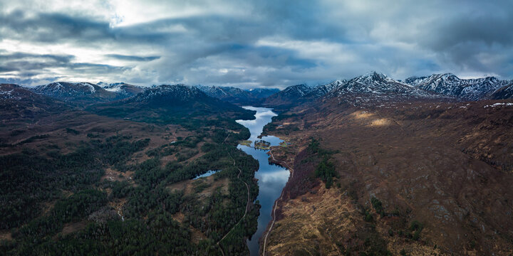 Aerial view of Glen Affric in the highlands of Scotland near Inverness and Canich showing the flat calm lochs amongst Munro mountains