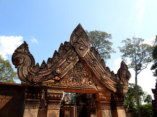 Fototapeta premium Banteay Srey is a 10th-century Cambodian temple dedicated to the Hindu god Shiva. Located in the area of Angkor, it lies near the hill of Phnom Dei. 