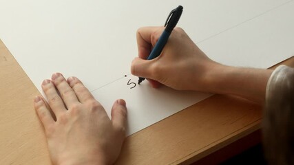 Young mathematician Pavel Kubarkov marks a point "S1" on the paper. Date of shooting day 23 December 2021 year, MSK time. This video was filmed in Russia.