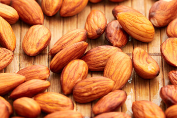 Almonds on a wooden surface.