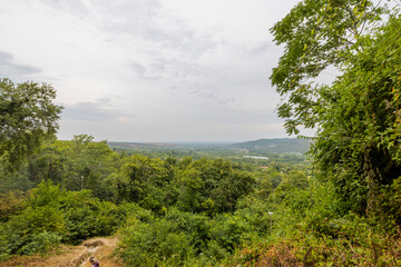 Obraz premium Beautiful green nature mountain landscape view on pale sky background. Greece.