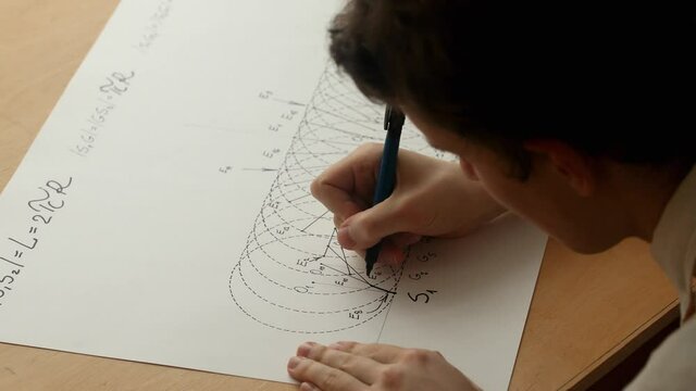 Young mathematician and artist Pavel Kubarkov, starts drawing arc of cycloid with using a black marker pen. Date of shooting day 28 December 2021 year, MSK time. This video was filmed in Russia.