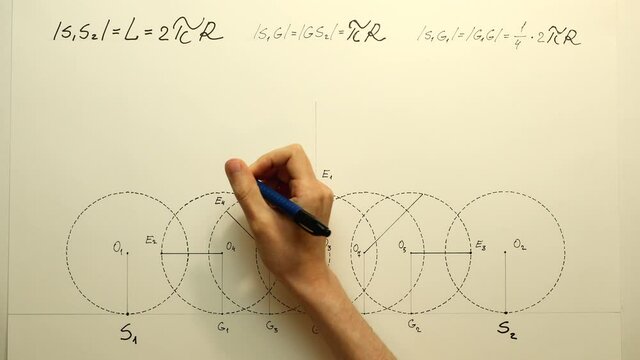 Young mathematician hand marks a points "E4" and "E5" on a circles for a cycloid construction. Date of shooting day 26 December 2021 year, MSK time. This video was filmed in Russia.