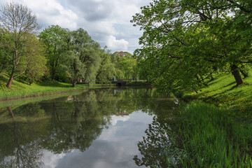 Fototapeta na wymiar beauty of spring park with bridge and pond view