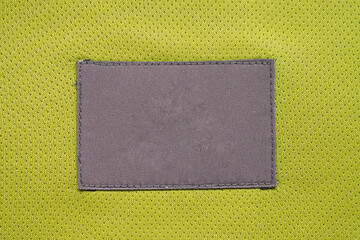 laundry care clothing label patch on polyester fabric jersey sport texture
