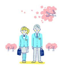高校生の男女と桜