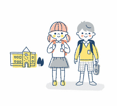 小学生の男女と学校