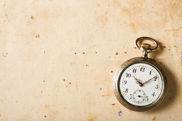 Vintage silver antique clock on old paper